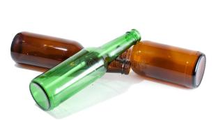 three-empty-beer-bottles-pile-16804845